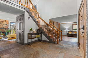 Entryway showing a view of the stairs going up to level 2