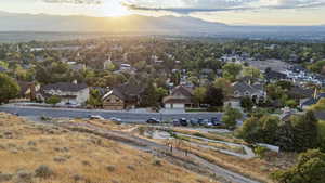 Aerial view of residential area featuring a mountainous background