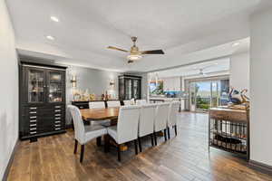 Dining space with recessed lighting, dark wood-style floors, and ceiling fan