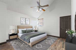 Bedroom featuring high vaulted ceiling, dark wood-style floors, and ceiling fan