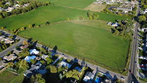 Aerial view of property's location featuring nearby suburban area