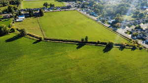 Overview of rural landscape featuring nearby suburban area