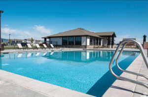 Community pool with a patio area