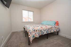 Bedroom featuring carpet