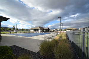 Community pool with a patio area