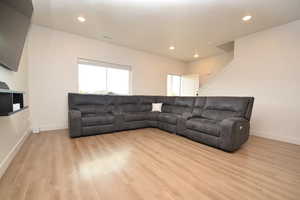 Living area featuring recessed lighting and light wood-style flooring