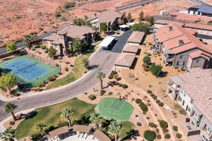 Aerial view of property and surrounding area with nearby suburban area