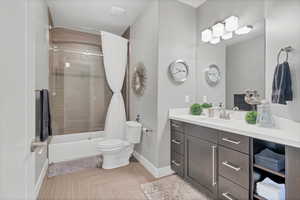 Full bath featuring shower / bath combo and vanity