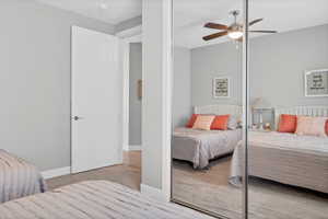 Bedroom featuring a ceiling fan and wood finished floors