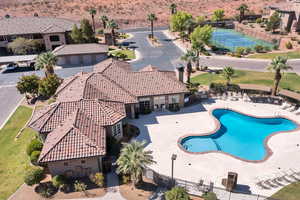 Community pool with a patio