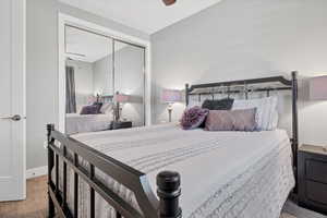 Bedroom featuring a closet and a ceiling fan