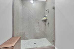 Full bathroom featuring a shower stall