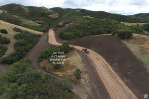 Aerial overview of property's location featuring a mountain backdrop