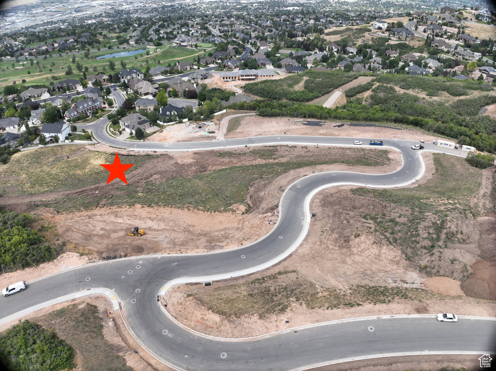 View of property location featuring nearby suburban area and a large body of water