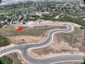 View of property location featuring nearby suburban area and a large body of water