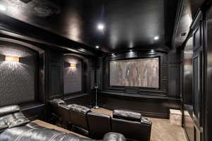 Home theater with light colored carpet and recessed lighting