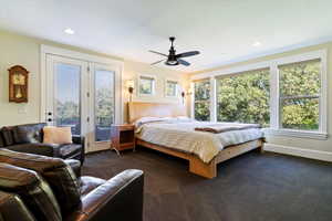 Carpeted bedroom featuring access to exterior, a ceiling fan, and recessed lighting
