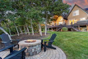View of patio featuring stairs and a wooden deck