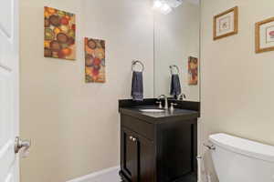 Half bath with vanity and toilet