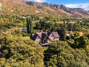 View from above of property with a mountain backdrop