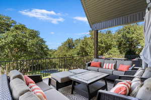 View of patio with an outdoor living space