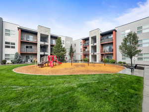 View of property's community featuring a lawn