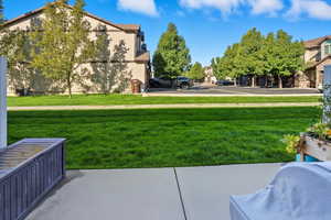 View of green lawn featuring a residential view