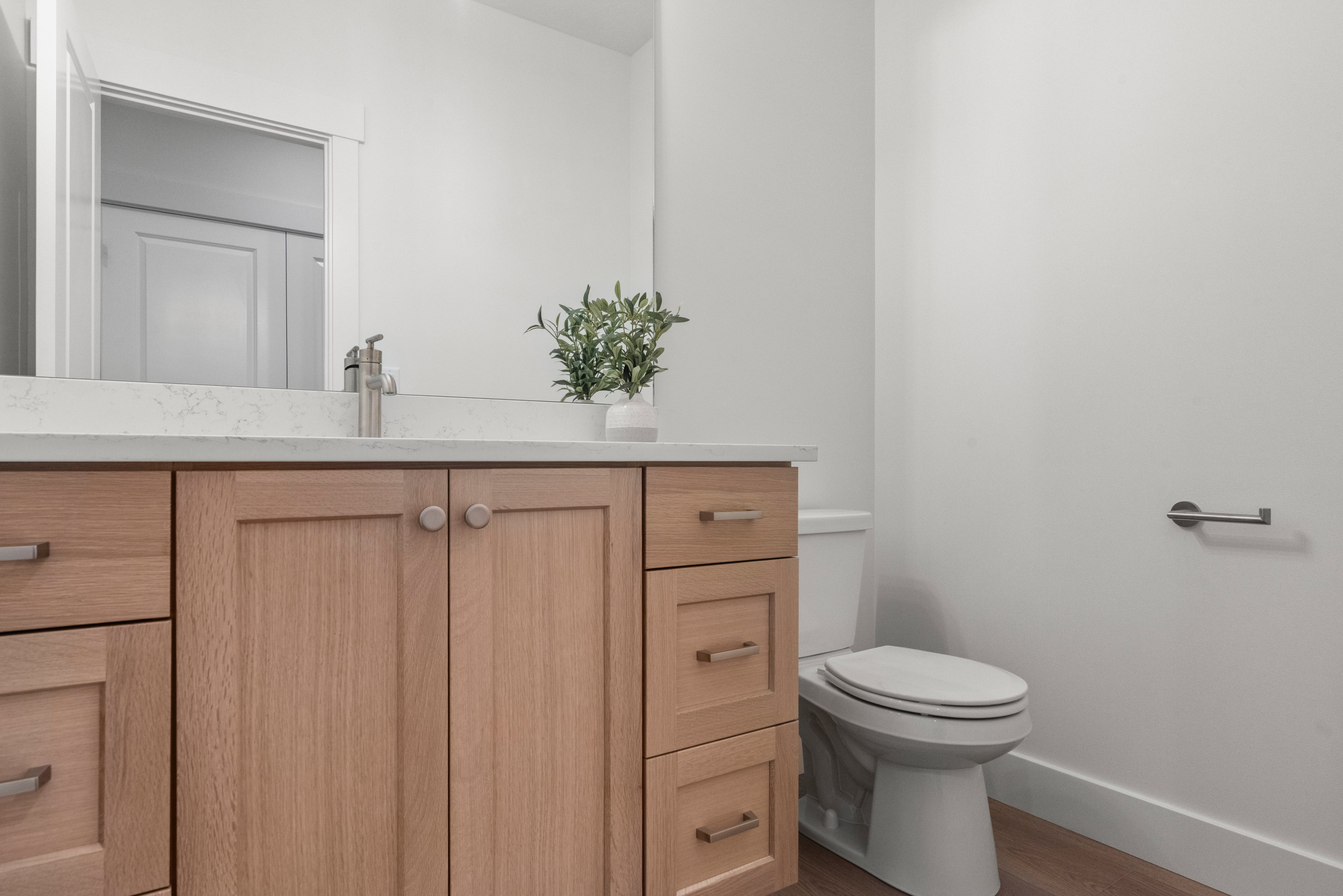 Bathroom featuring vanity and wood finished floors