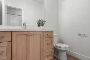 Bathroom featuring vanity and wood finished floors