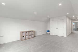 Additional living space with recessed lighting, carpet, and lofted ceiling