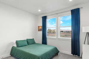 Bedroom with carpet floors, a mountain view, and recessed lighting