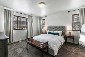 Large primary bedroom with lots of natural light.