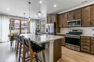 Extra large island, gas stove, and amazing views of mountains! Quartz counter tops and LVP throughout main living area are great upgrades!