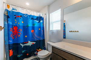 Main bath with extended vanity area.