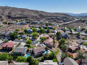 Aerial perspective of suburban area with a mountain backdrop