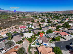 Aerial perspective of suburban area with a mountainous background