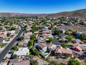Aerial perspective of suburban area featuring a mountain backdrop
