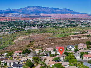 Aerial view of residential area featuring a mountain backdrop