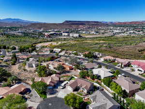 Aerial perspective of suburban area featuring a mountainous background