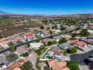 Aerial perspective of suburban area with a mountain backdrop