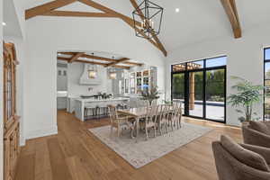 Dining room with recessed lighting, light wood-style floors, and a chandelier
