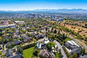 Aerial view of residential area featuring a mountainous background