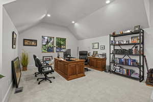 Home office featuring light carpet, lofted ceiling, and recessed lighting