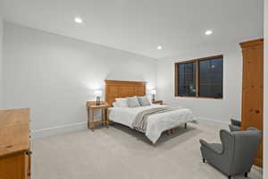 Bedroom with recessed lighting and light carpet