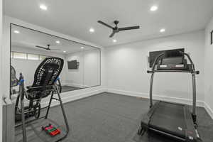 Exercise area with recessed lighting, carpet, and ceiling fan
