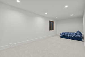 Bedroom featuring recessed lighting and carpet flooring