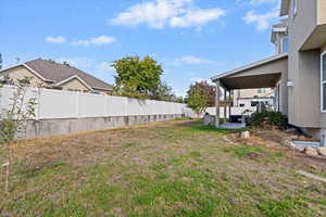 Fenced backyard featuring a patio