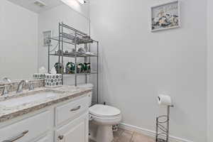 Bathroom with vanity and light tile patterned flooring