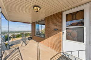 Entrance to property featuring brick siding