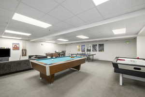 Rec room with pool table, carpet, and a drop ceiling